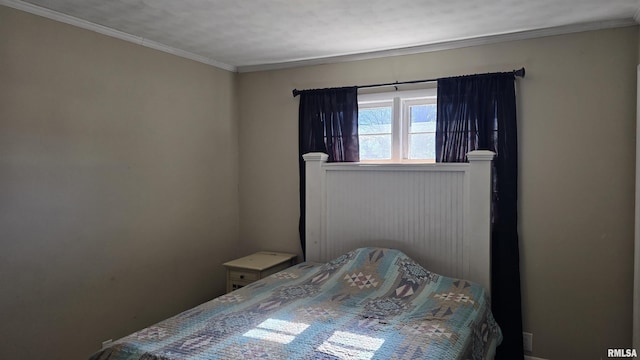 bedroom with crown molding