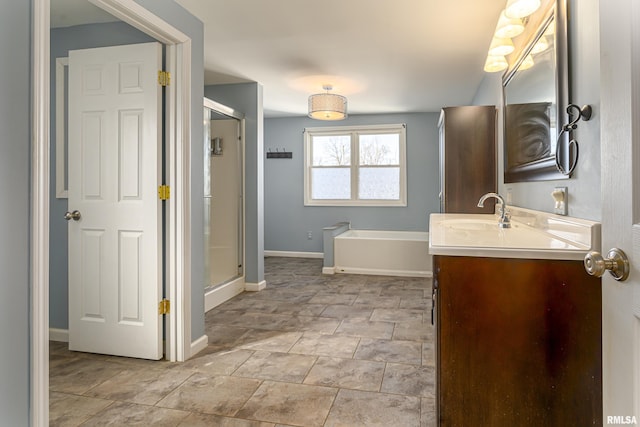 bathroom featuring vanity and shower with separate bathtub