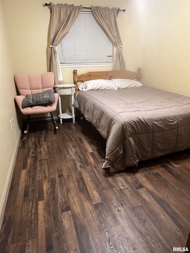 bedroom featuring dark hardwood / wood-style floors