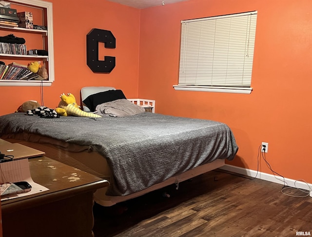 bedroom featuring hardwood / wood-style flooring