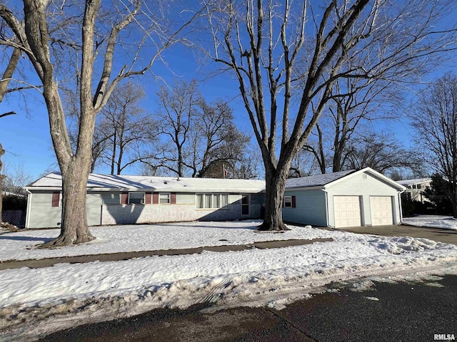 view of front facade featuring a garage and an outdoor structure