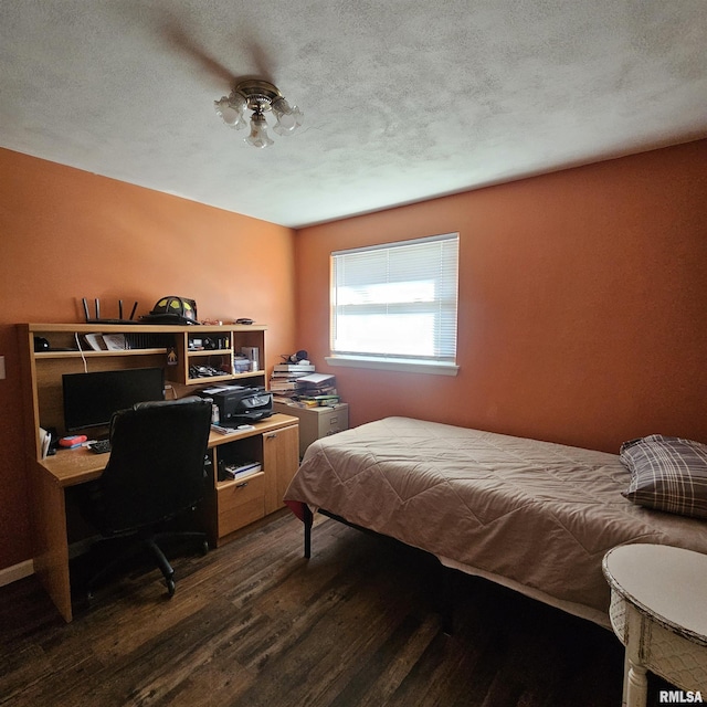 bedroom featuring dark hardwood / wood-style flooring