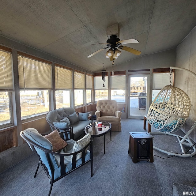 sunroom featuring vaulted ceiling and ceiling fan