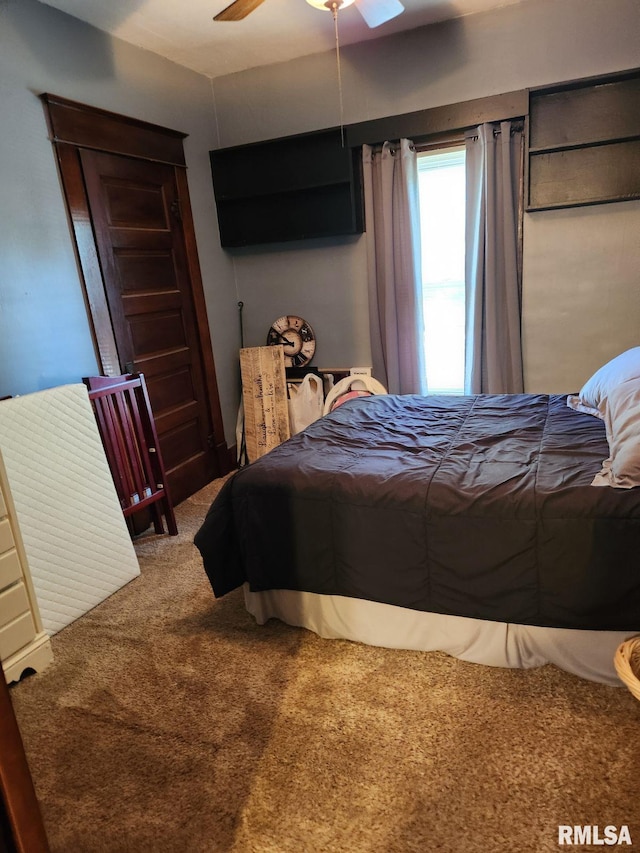 bedroom with ceiling fan and carpet floors