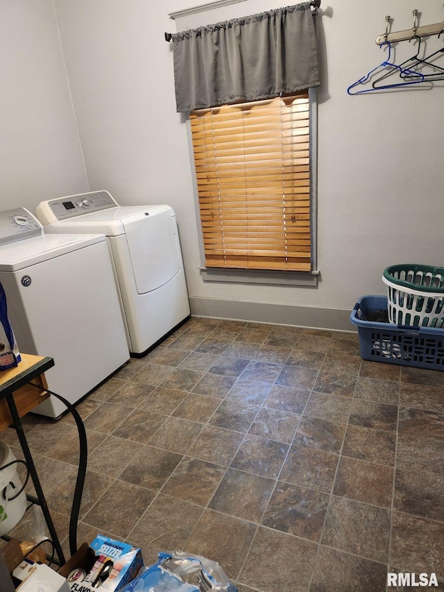 washroom with washing machine and clothes dryer