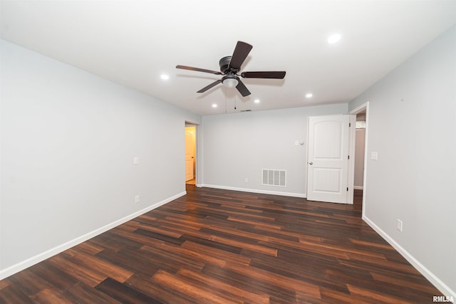 unfurnished room with ceiling fan and dark hardwood / wood-style floors