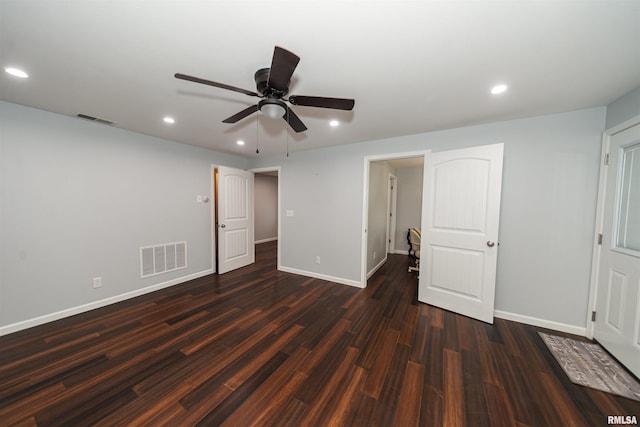 unfurnished bedroom featuring ceiling fan and dark hardwood / wood-style floors