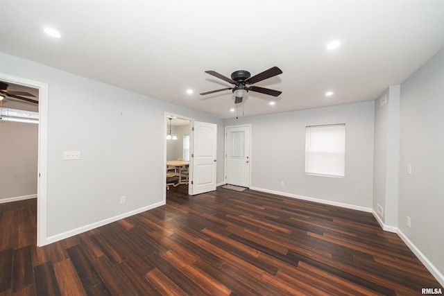 unfurnished bedroom featuring dark wood-type flooring and ceiling fan