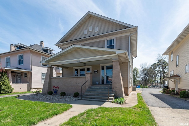 view of front of property with a front lawn and a porch