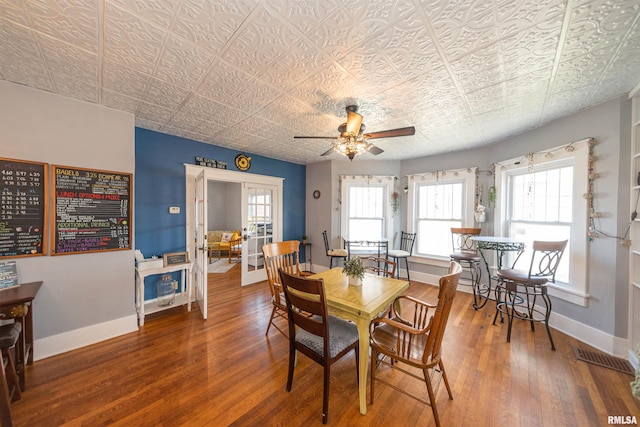 dining room with ceiling fan, hardwood / wood-style flooring, and french doors