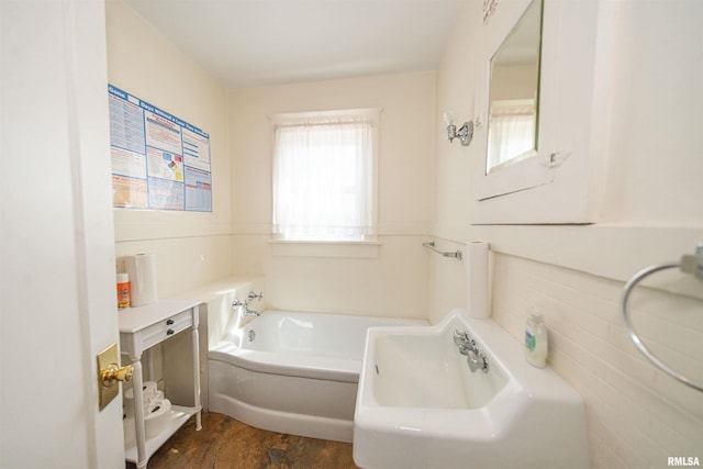 bathroom with sink and a bath