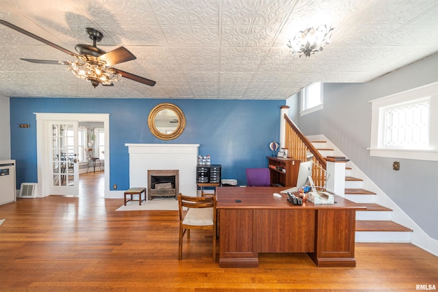 office featuring ceiling fan, wood-type flooring, and french doors