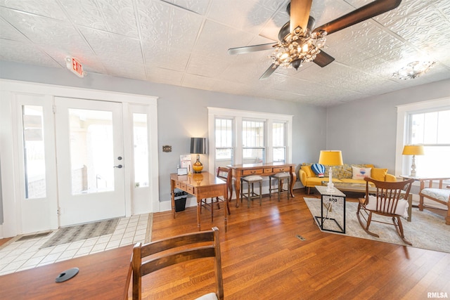 dining space featuring ceiling fan and wood-type flooring