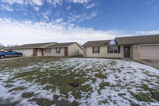 single story home featuring a garage