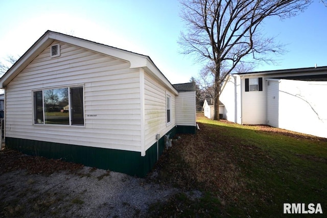 view of home's exterior featuring a lawn