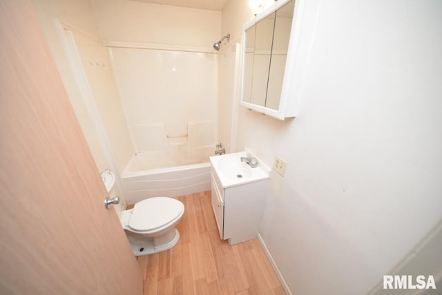 full bathroom with shower / bath combination, hardwood / wood-style floors, toilet, and vanity