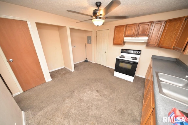 kitchen with a textured ceiling, range with electric stovetop, dark carpet, and sink