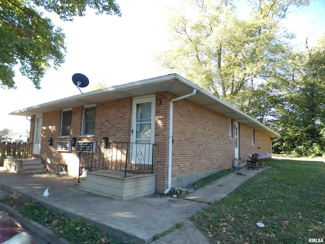 view of side of property with a yard