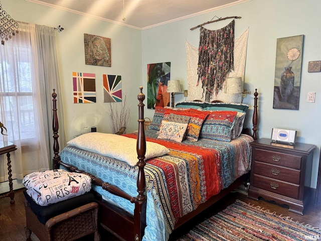 bedroom featuring dark wood-type flooring and crown molding