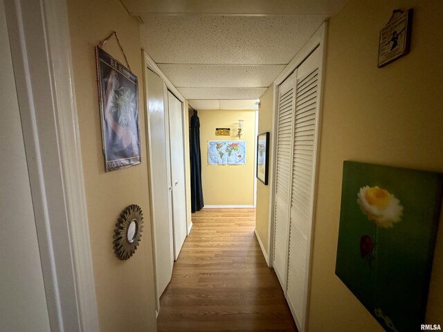 hallway with light hardwood / wood-style flooring