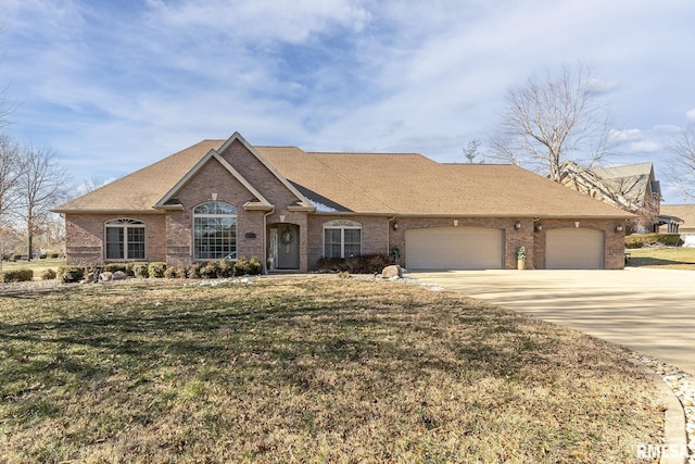 ranch-style home with a front yard and a garage