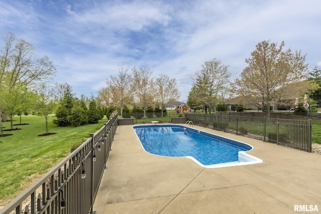 view of pool featuring a yard, a patio area, a fenced in pool, and fence