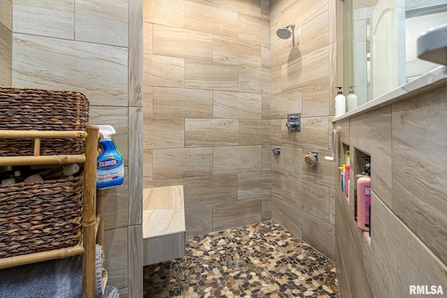 bathroom with tiled shower