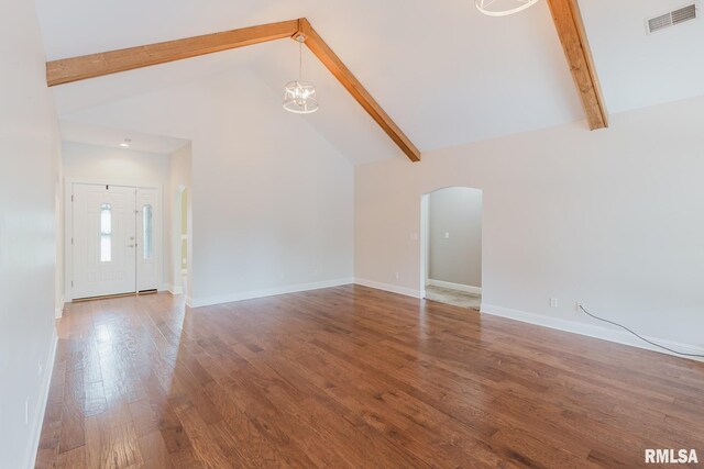 2730 Kokopelli Dr, Marion, IL 62959 - unfurnished living room featuring arched walkways, high vaulted ceiling, beamed ceiling, a chandelier, and wood finished floors