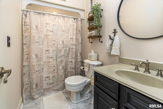 bathroom featuring toilet and vanity