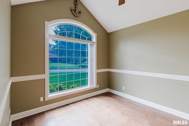 2730 Kokopelli Dr, Marion, IL 62959 - spare room with wood finished floors, plenty of natural light, vaulted ceiling, and ceiling fan