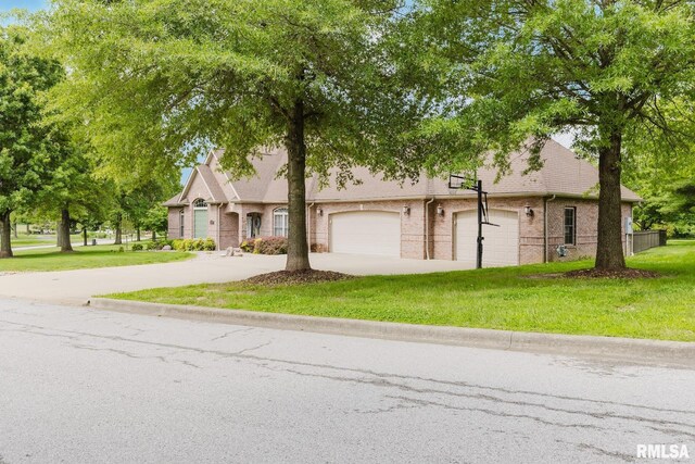 2730 Kokopelli Dr, Marion, IL 62959 - view of front of home with concrete driveway, a garage, a front yard, and brick siding
