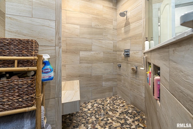 full bathroom with a tile shower