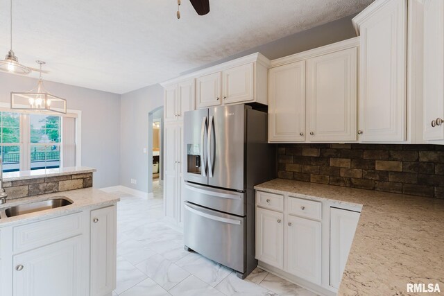 2730 Kokopelli Dr, Marion, IL 62959 - kitchen featuring stainless steel refrigerator with ice dispenser, backsplash, light marble finish flooring, and decorative light fixtures