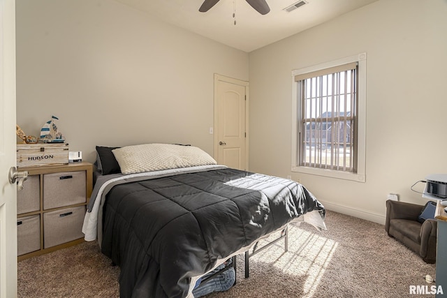 bedroom featuring ceiling fan, baseboards, visible vents, and carpet floors