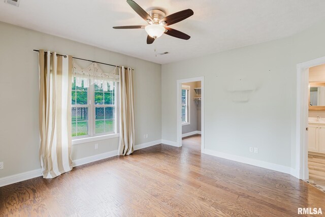 2730 Kokopelli Dr, Marion, IL 62959 - spare room with light wood finished floors, a ceiling fan, and baseboards