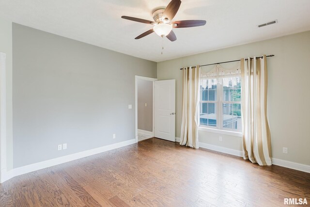 2730 Kokopelli Dr, Marion, IL 62959 - empty room with a ceiling fan, wood finished floors, and baseboards