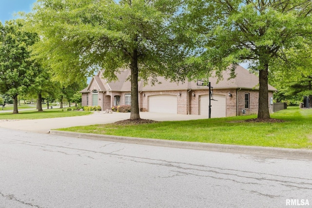 2730 Kokopelli Dr, Marion, IL 62959 - view of front of property featuring concrete driveway, a front yard, and an attached garage