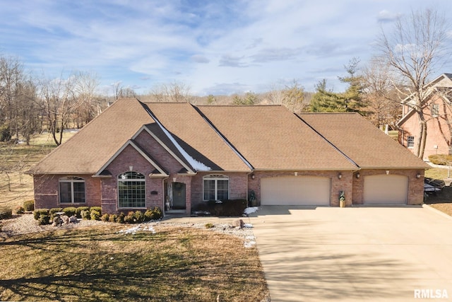 view of front of house with a garage and a front yard