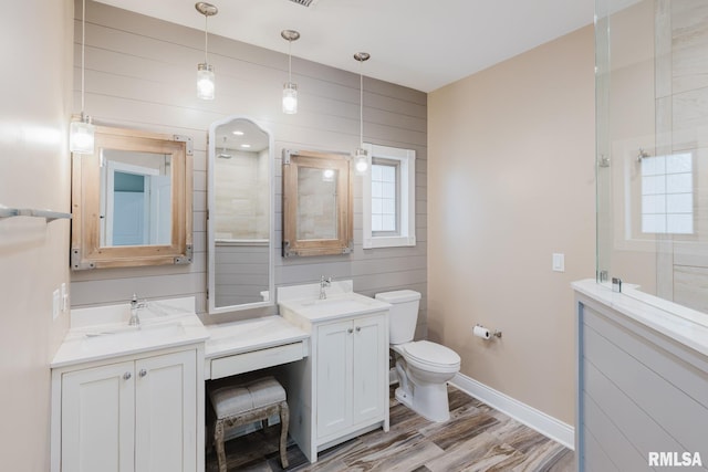 2730 Kokopelli Dr, Marion, IL 62959 - bathroom with vanity, toilet, wood finished floors, baseboards, and a shower