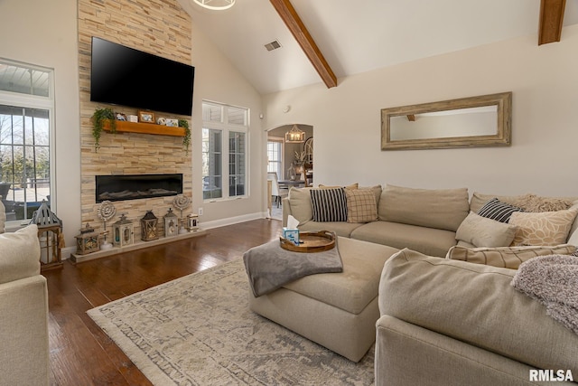 living room featuring high vaulted ceiling, plenty of natural light, beamed ceiling, and dark hardwood / wood-style floors