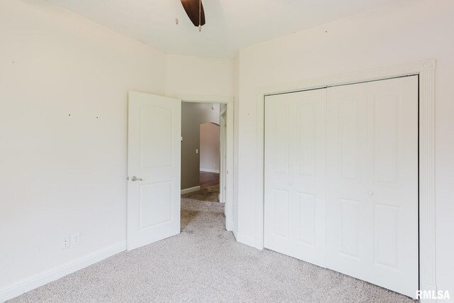 2730 Kokopelli Dr, Marion, IL 62959 - unfurnished bedroom featuring light carpet, a closet, baseboards, and a ceiling fan