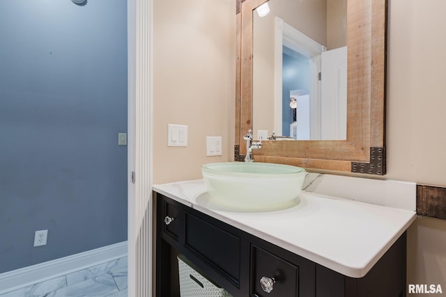 2730 Kokopelli Dr, Marion, IL 62959 - bathroom featuring marble look tile flooring, vanity, and baseboards