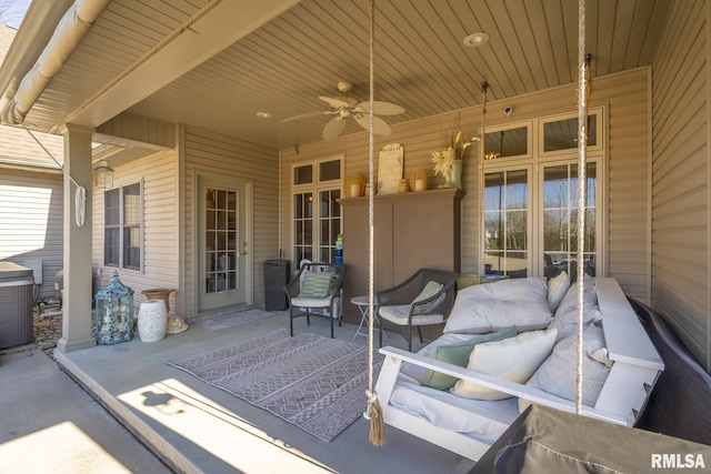 view of patio with outdoor lounge area and a ceiling fan