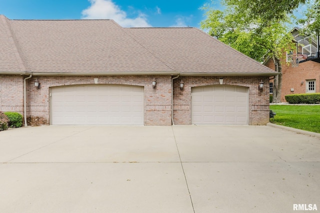 2730 Kokopelli Dr, Marion, IL 62959 - view of home's exterior featuring concrete driveway, brick siding, an attached garage, and roof with shingles