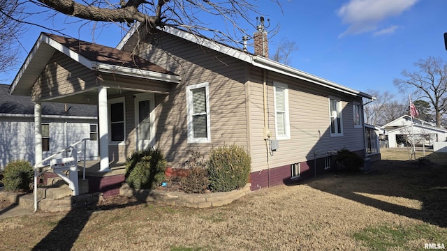 view of property exterior featuring a yard