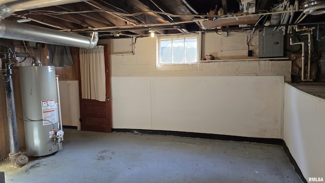 basement featuring electric panel and gas water heater