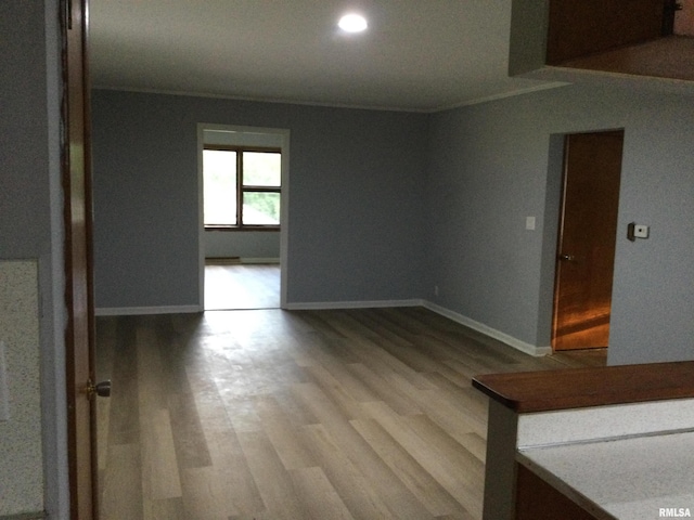 empty room with hardwood / wood-style flooring