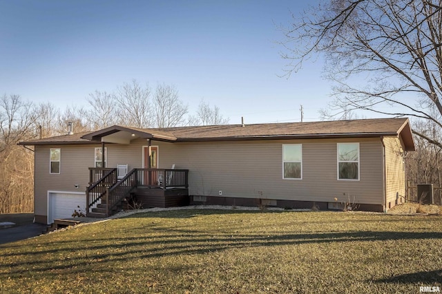 view of front of house with a front yard and a garage