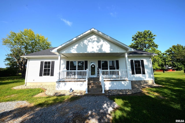 view of front of property featuring covered porch and a front lawn