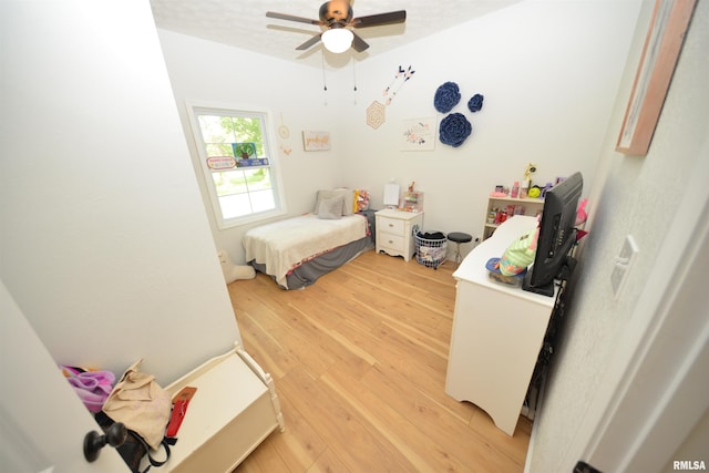 bedroom featuring light wood-type flooring and ceiling fan